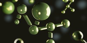 Green molecule structure on a dark background