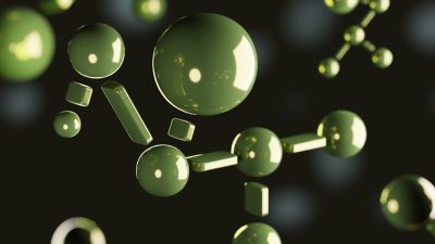 Green molecule structure on a dark background