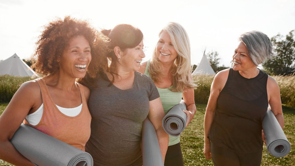 Midlife women enjoying time together outdoors.