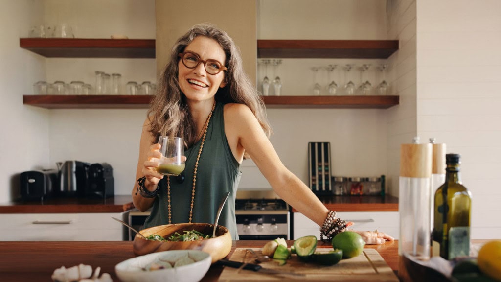 Midlife woman relaxing at home during a quiet moment.
