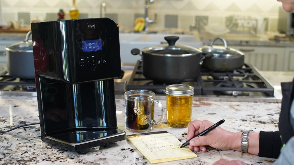 cannabis infusion device used to control temperature and timing during oil infusion