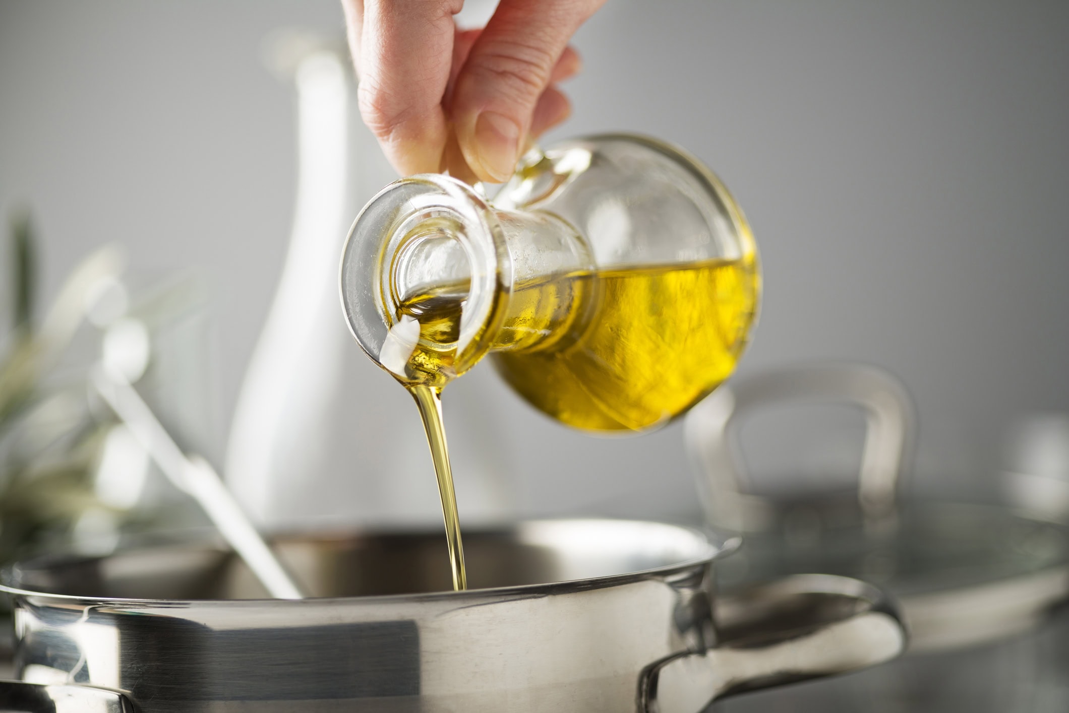 cannabis cooking oil being poured into pan during infusion process