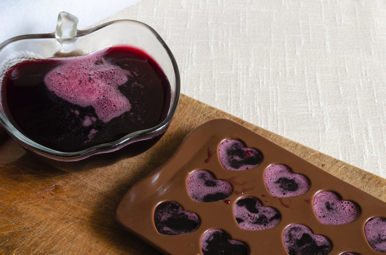 Silicone candy molds filled with homemade fruit gummies for making weed edibles at home
