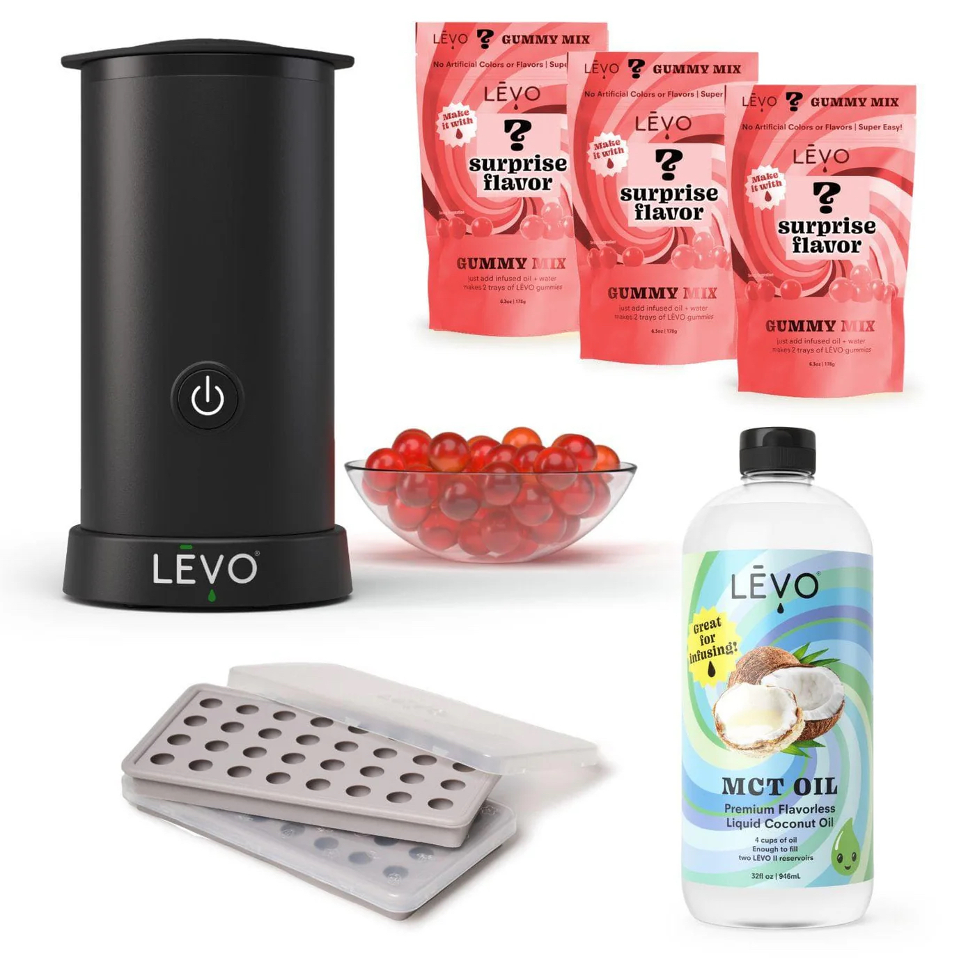 LEVO gummy-making kit with the LEVO infusion machine, surprise-flavor gummy mixes, silicone gummy molds, a bowl of finished gummies, and a bottle of LEVO MCT oil.